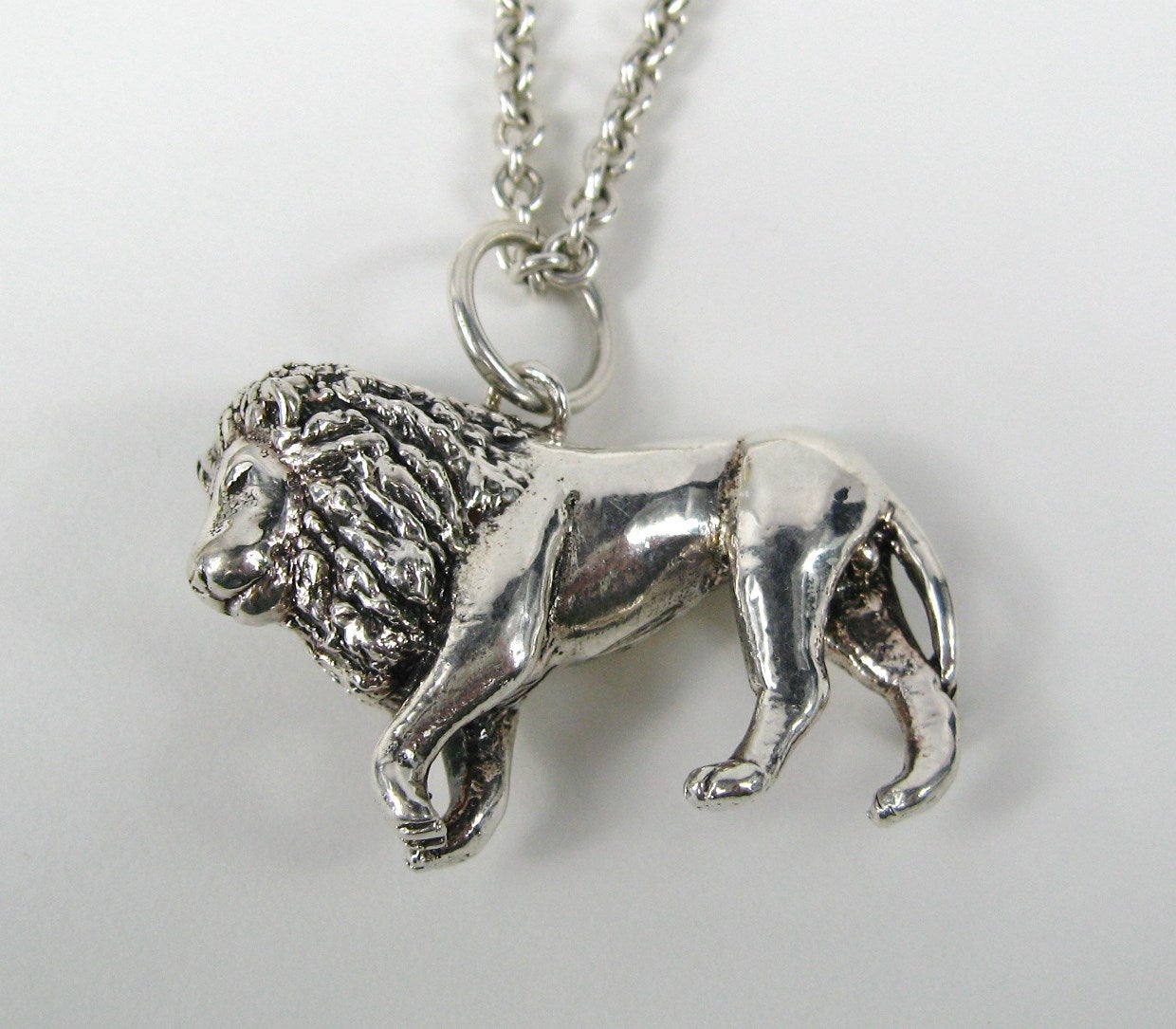 The Early work of New Mexico silversmith Carol Felley rarely comes along and when it does, it's a thrill because her designs are so amazing. This sterling silver necklace is stunning
3-D Figural Lion 
Early 1990s
Hallmarked CF
measuring
Chain