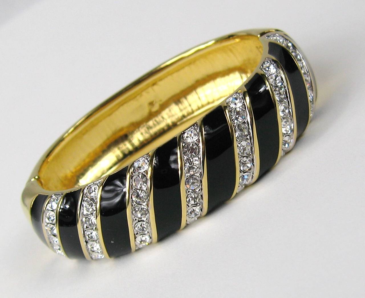 Stunning Swarovski Gold Gilt Bracelet
Large crystals set on an angle 
Hinged with slide in clasp 
Measuring 
.71