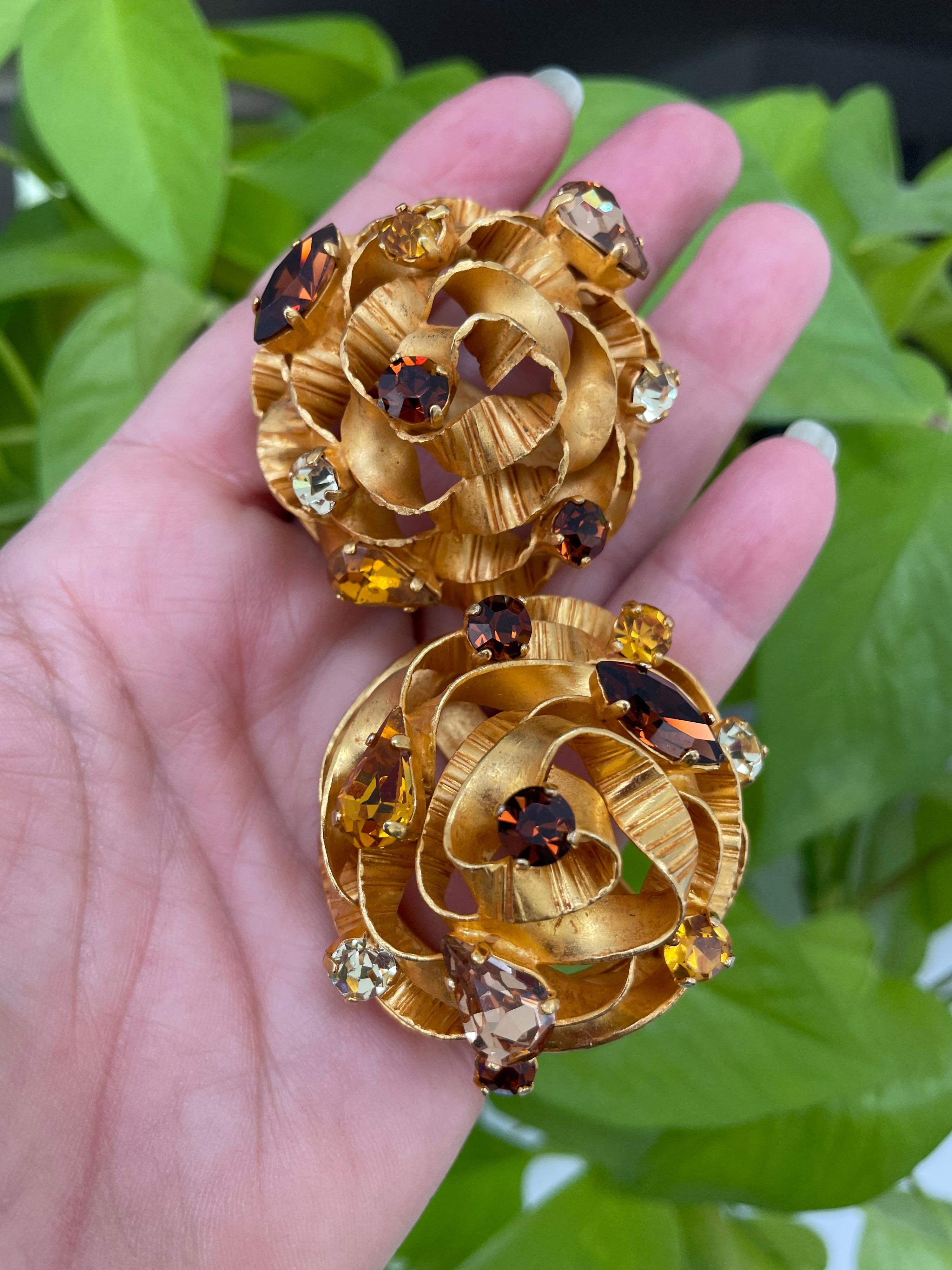 spectacular Aurientis Crystal Clip On earrings. These are truly a work of art, like a ribbon swirling around those prong set Swarovski Crystals. Stunning! Ribbons of Gilt metal layered with prong set Swarovski crystals in clear, yellow, green and