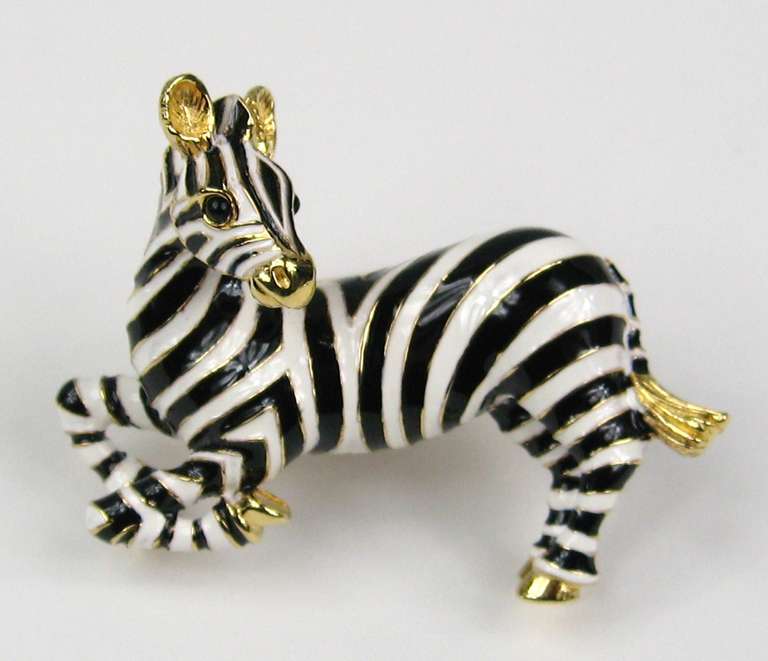 Black and white with just a hit of gold tone Zebra by Ciner

Measuring 2.65
