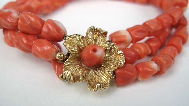 Stunning 3 strand coral bracelet with a floral 14k Gold Clasp. Bracelet measures 8.5