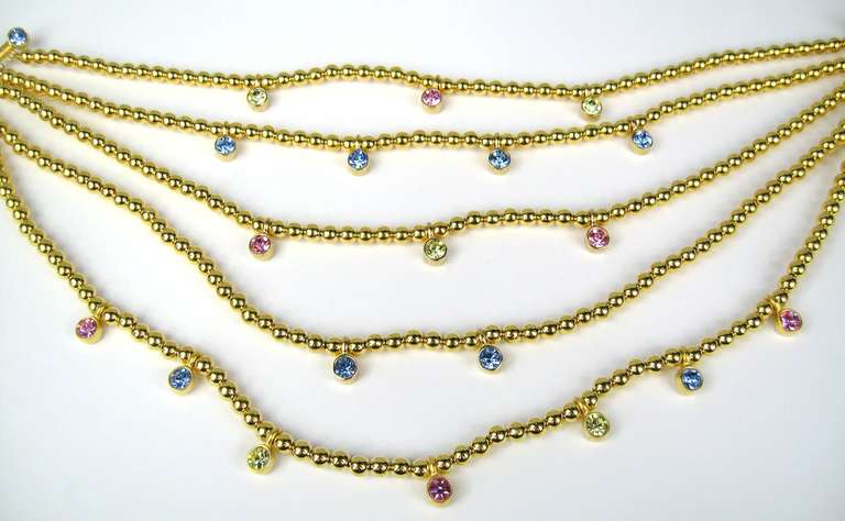 5 Strand Karl Lagerfeld beaded Neckace
Drops from 
Pink, blue and green Crystals

95% of our costume jewelry is new old stock
Purchased out of a prominent Westchester County NY estate.
Our client purchased her jewelry from Neiman Marcus.
Any