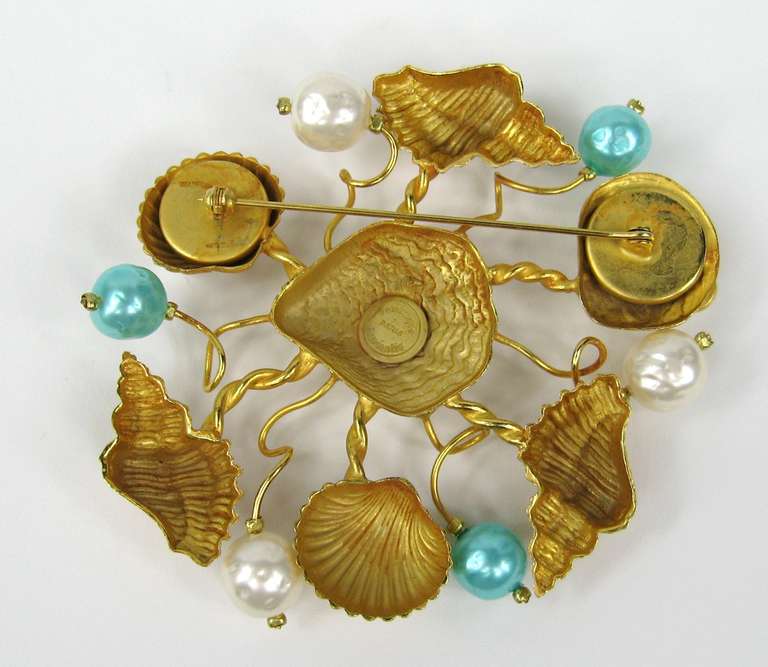 Another amazing Dominique Aurientis Brooch which is very Large in scale 
Shell motif with Green and White Faux pearls set in Gilt Gold 

Measures 3.37