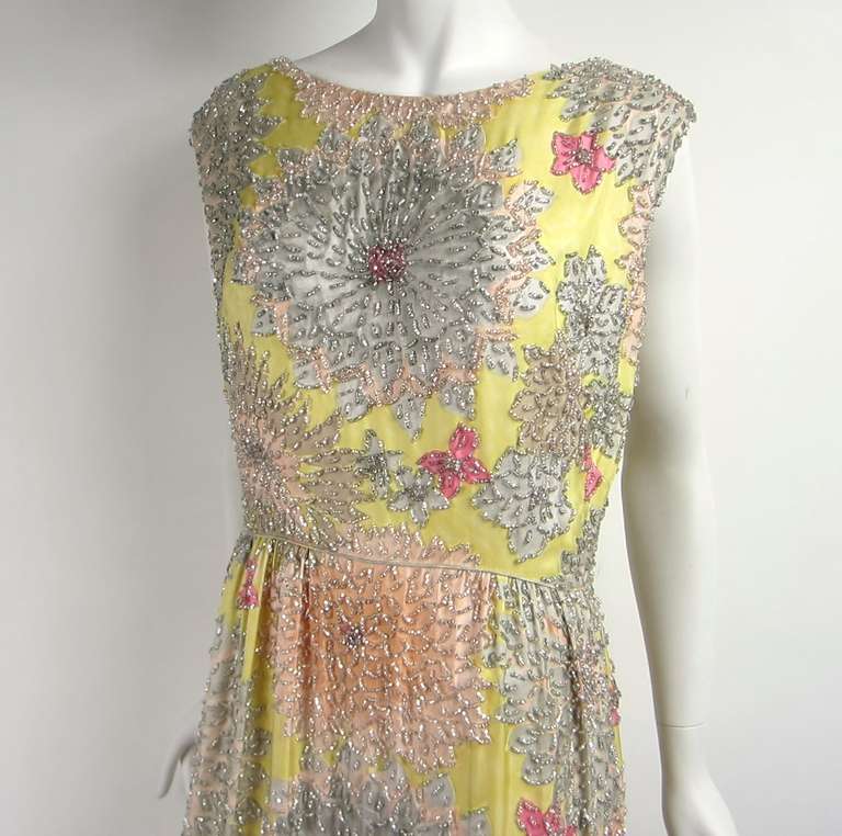 Stunning beading on this pastel Colored beaded gown by Malcolm Starr
Measuring 
Bust 38