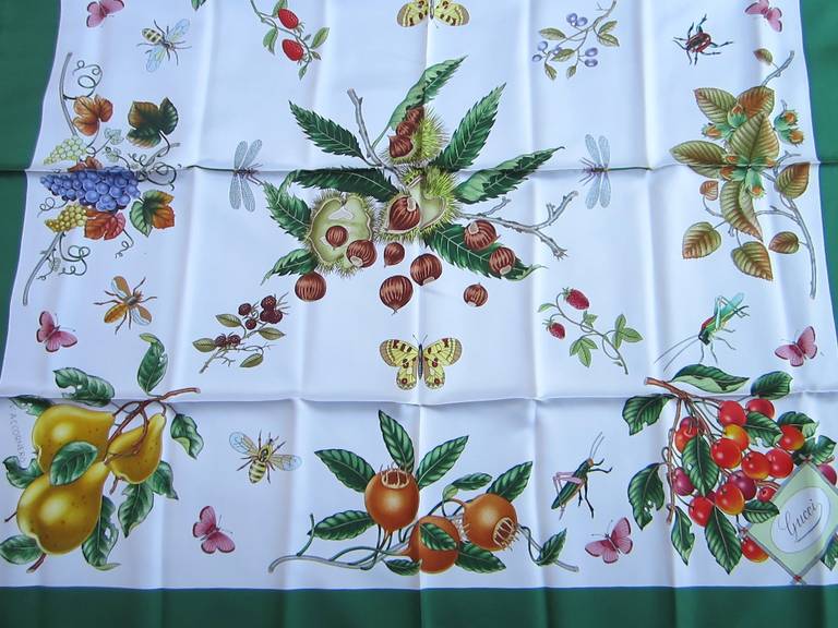This is from a Vast Collection of Gucci Scarves that have never been worn.

V. Accornero 
Featuring a Variety Fruits and Grasshoppers 
Stunning Green border, white background and colorful fruit
Made in Italy
Hand Rolled Silk
