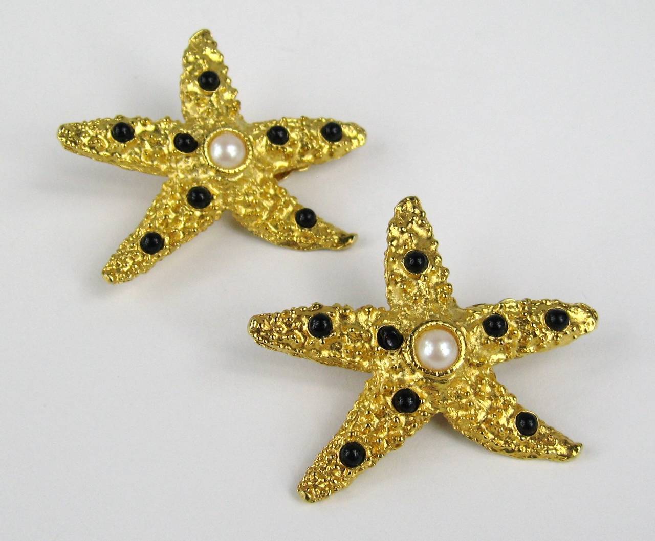 Yosca Star Fish Earrings, Clip on's. 
Poured Glass with Pearl Center. Hallmarked
2
