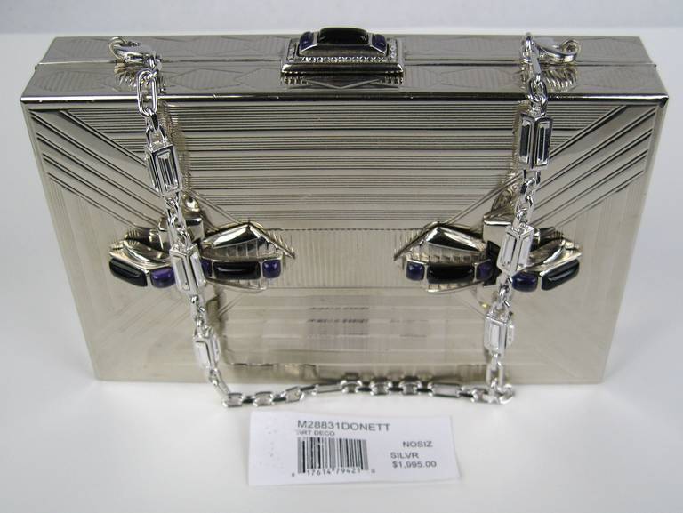 Silver Tone Judith Leiber Clutch 
Art Deco design Purple Crystals

Chain has clear Crystals on it
measures 6.25