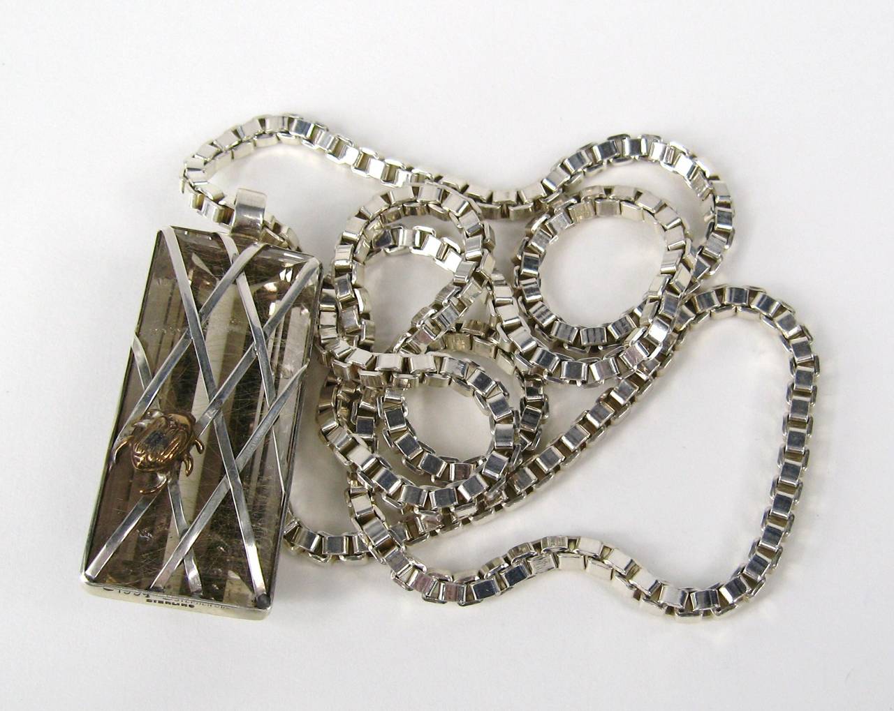 One of Dweck ONE OF KIND Quartz and sterling silver necklace. Quartz caged inside Sterling. Stunning piece. This was purchased in the early 1990s and never worn . Take a look at the all the photos. Measures 2 inches x .94 inches.  Chain 30 inches.