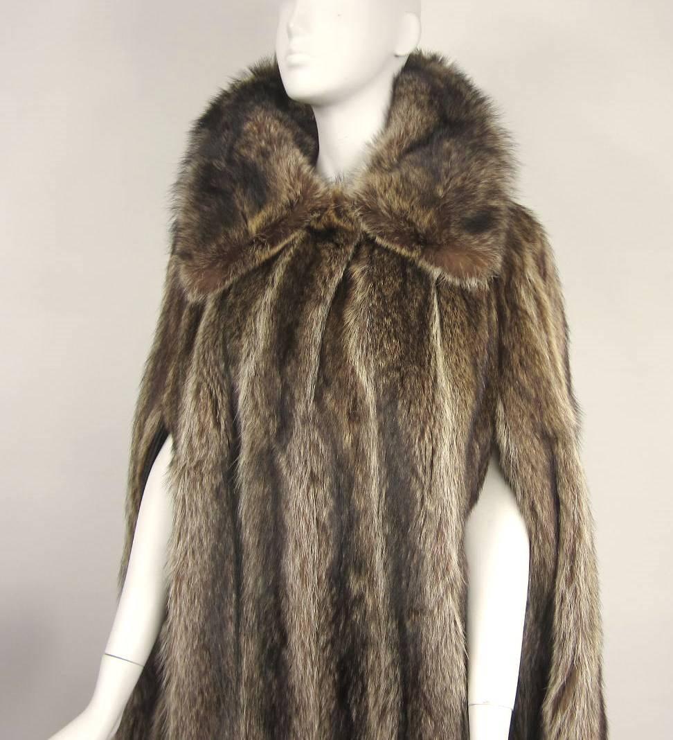 Lux Raccoon Cape 
leather trimmed arm holes 
Over sized collar 
Will fit a Medium
Measures 
7