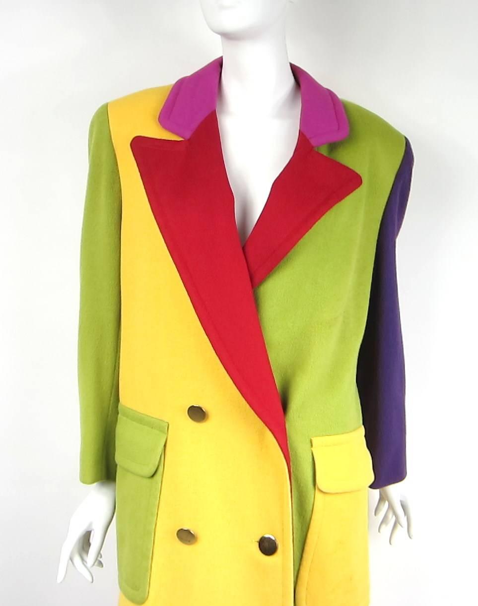 A rainbow of colors on the wool Bill Blass Jacket

Large patch front pockets 
Green, yellow, red, purple and pink

Love the sleeves, opposite colors. The pockets as well.

This Jacket screams FUN!! 
Measurements taken laying flat 
This