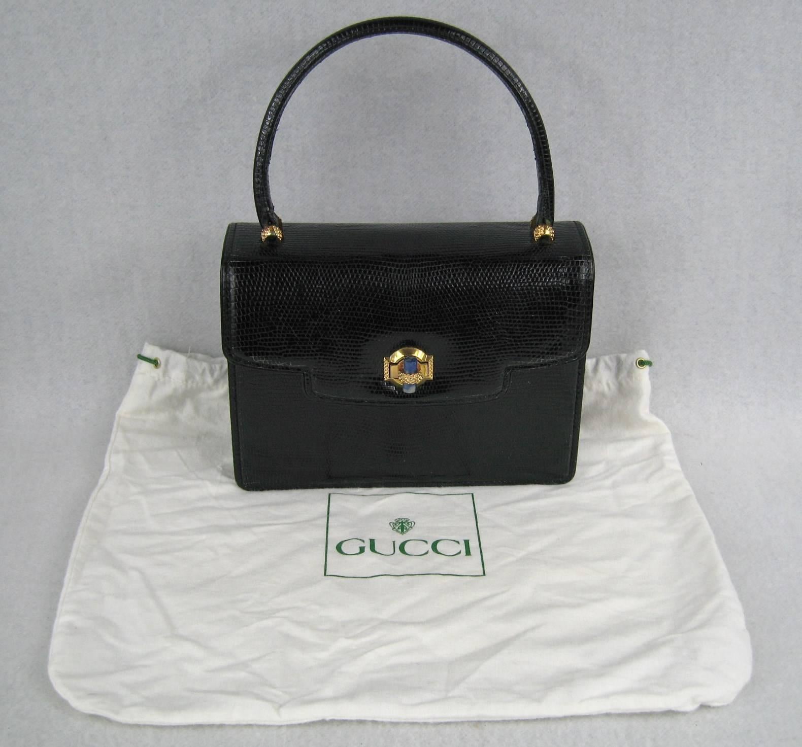 Oh so Jackie O...This is a Vintage Gucci handbag is wonderful condition 
Lapis closure 
Gold tone hardware 
Measuring 
8