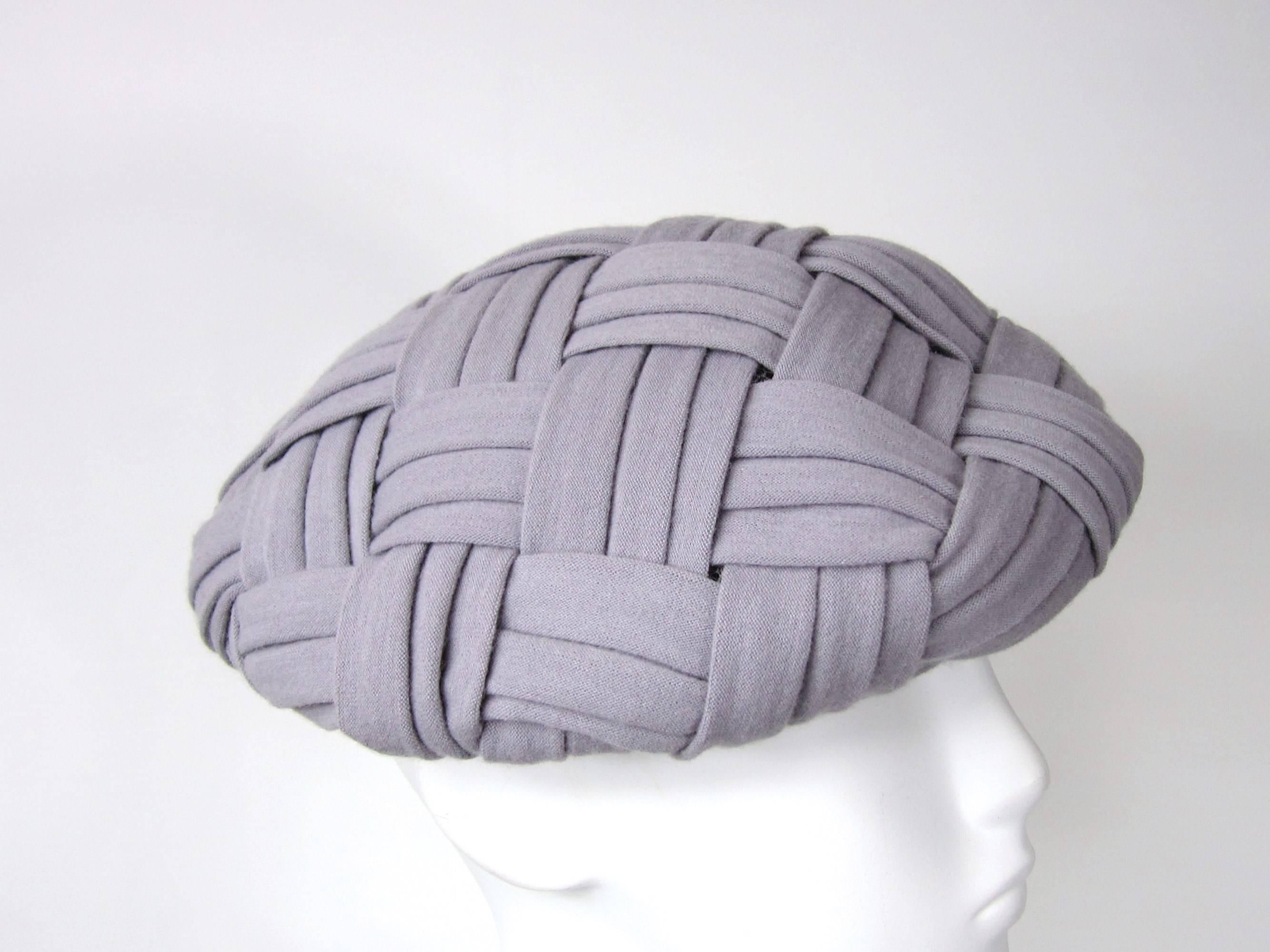 Weaved Beret Christian Dior 
Circa 1960s 
21 in diameter 
Has a tint of a purple hue 
Tulle lined 

Any questions please call or hit request more information 