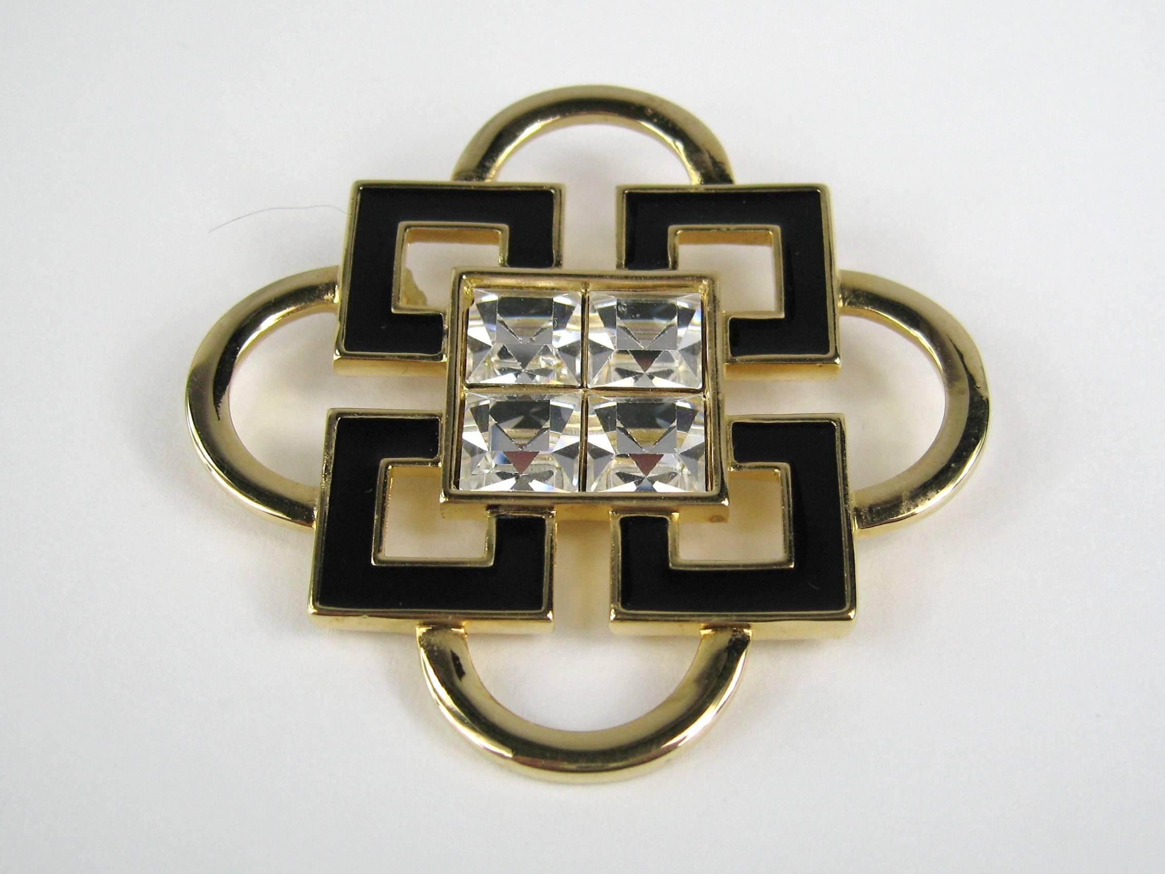 New Old Stock Swarovski Vintage Brooch. 
Great Sparkle! 
Large Bezel set crystals in the center, surrounded by Black Enamel.
Sure makes a statement! Classic 
measures 
 55.79mm or 2.19