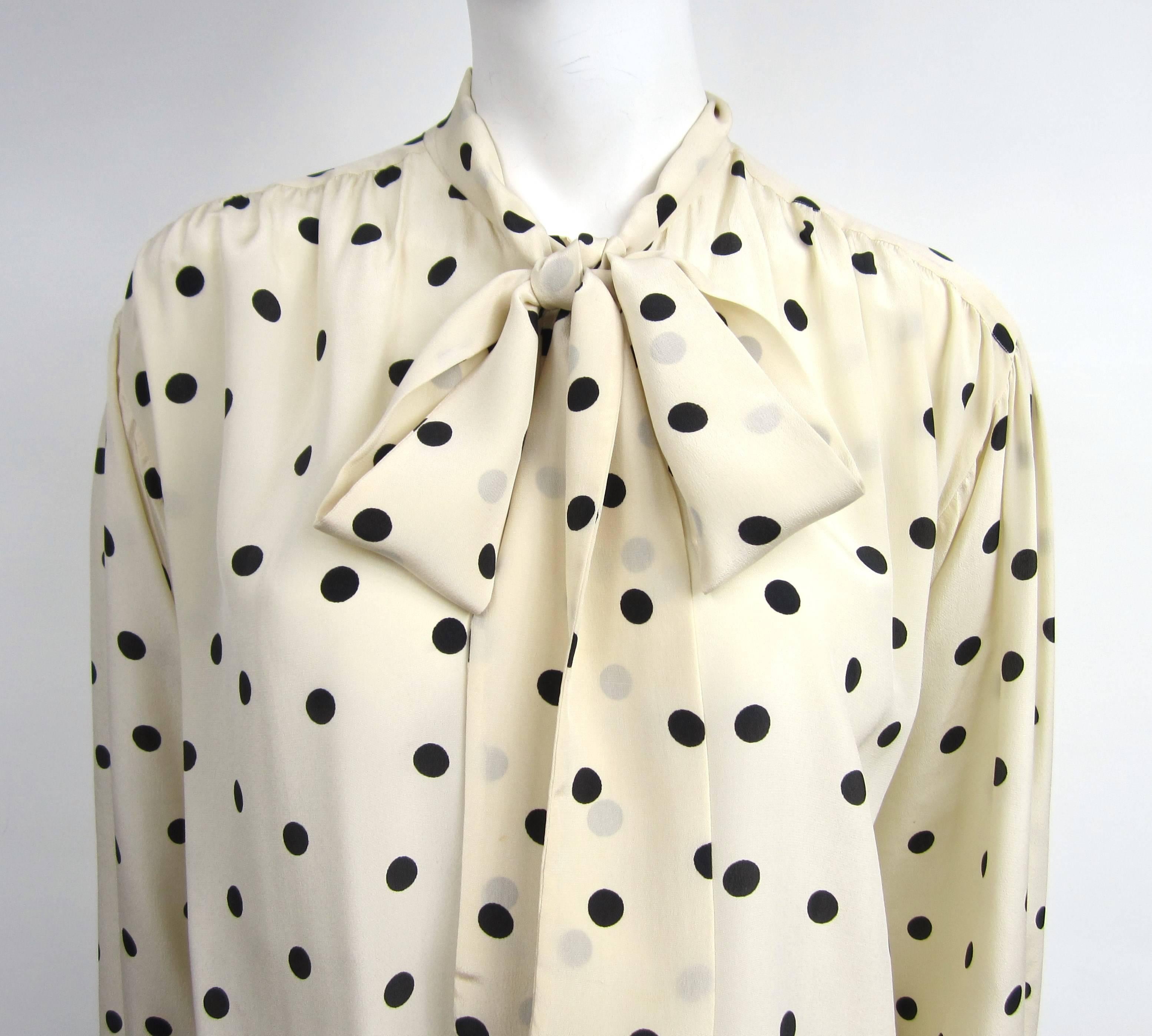 Vintage Silk YSL Polka Dot silk blouse 
5 buttons down the front 
Ascot tie 

Measuring 
Up to 40