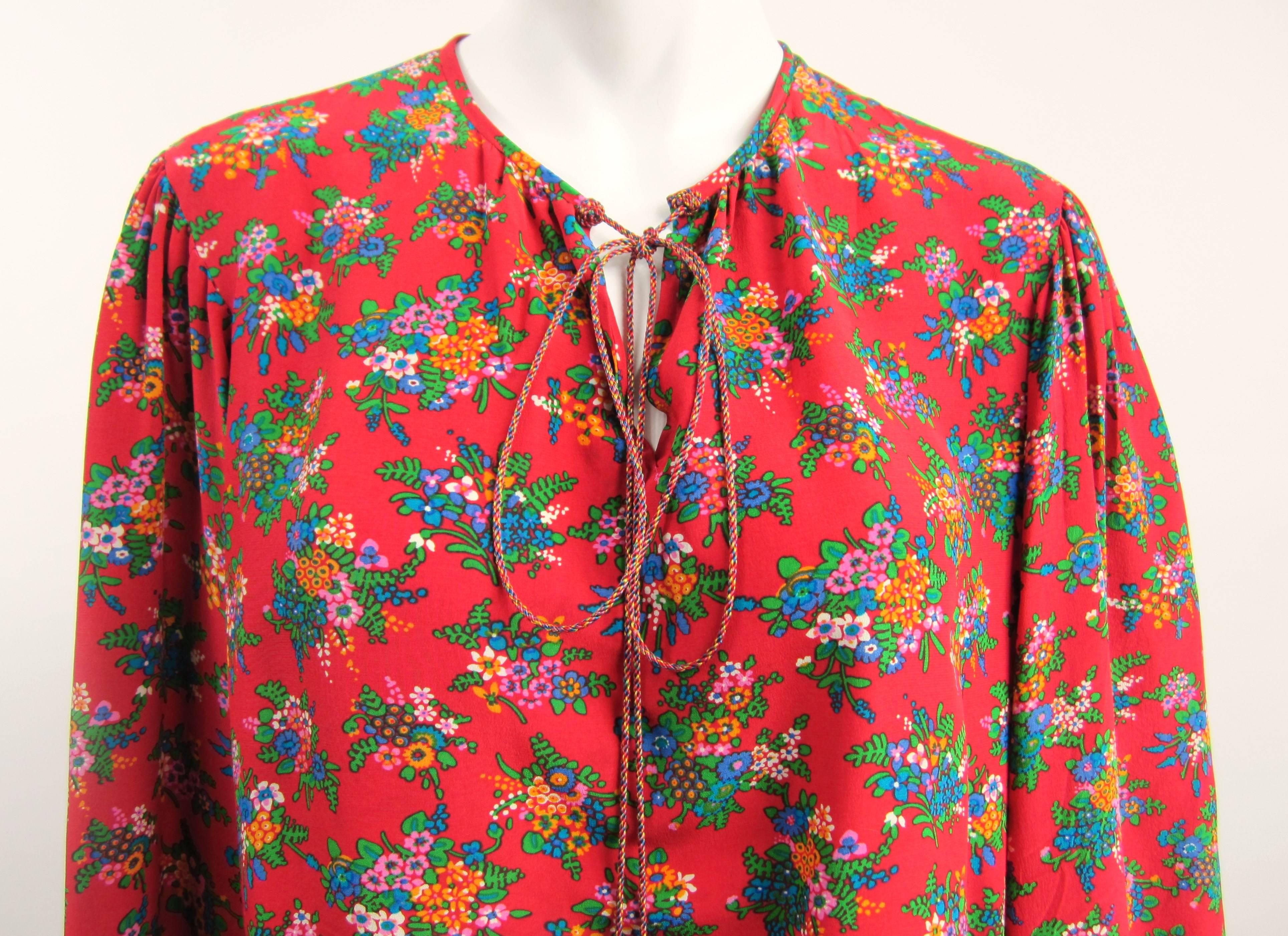 Silk vintage YSL shirt 
Bohemian vibe on this 1970s multi colored top 
Rope closure with deep v opening at the bust  
Measuring 
Up to 42