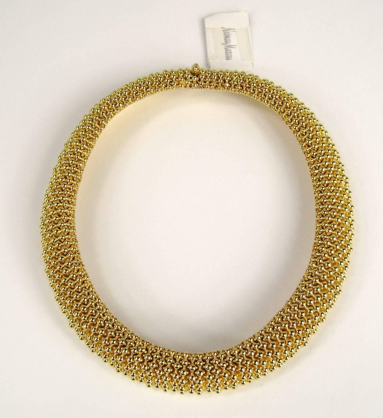 Stunning Gold tone Ciner Choker necklace, which has never been worn. 
Purchased at Neiman Marcus in the late 1980s and stored away till now. 
Matching earrings available on our storefront as well.
Measuring 
.80 wide and approximately 17