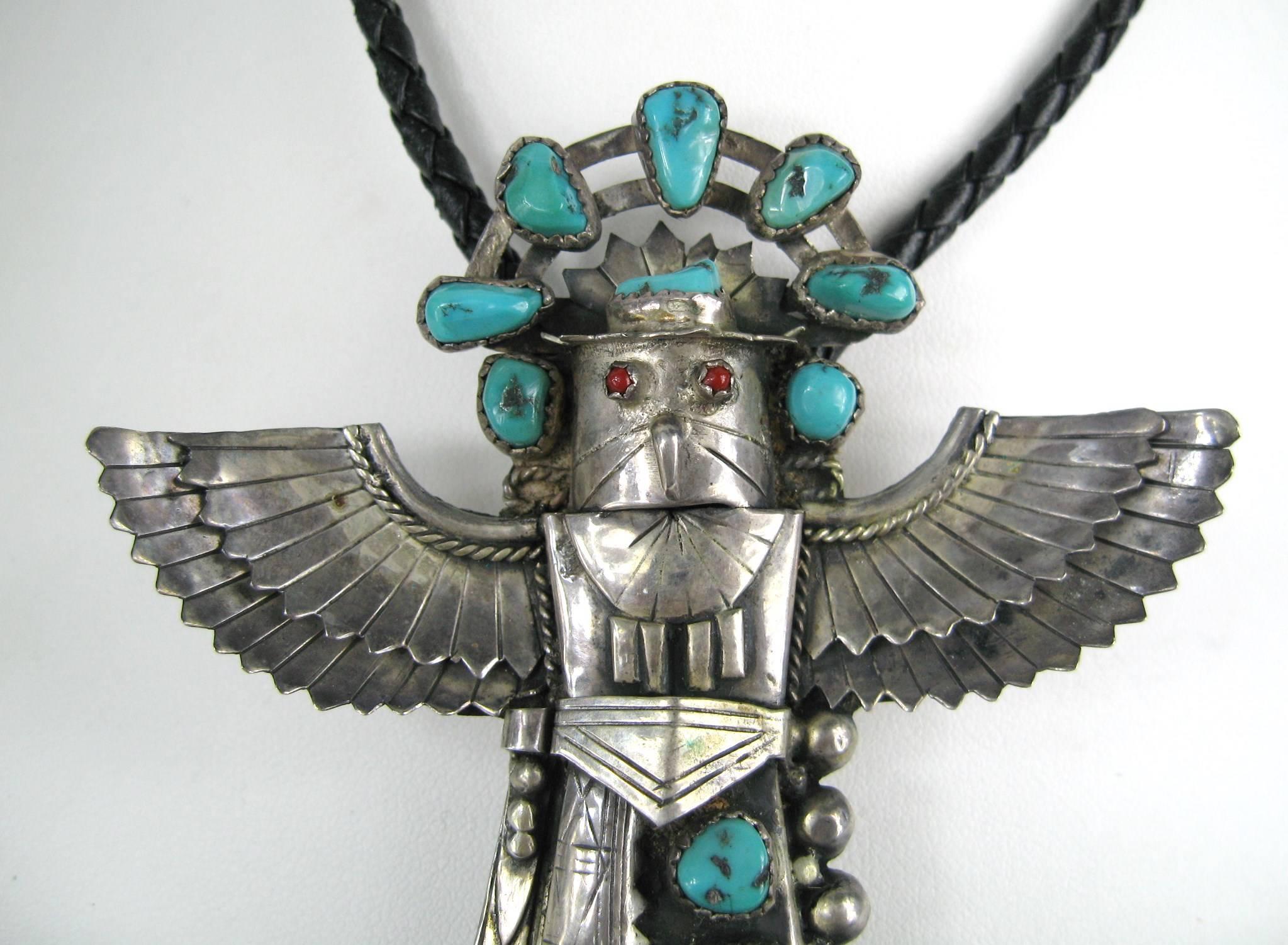 Navajo handmade Sterling Silver & Turquoise EAGLE with coral eyes
Hallmarked on the back BL 
Chunky Kingman Turquoise Stones and Coral Eyes

The center Bolo is 3.30