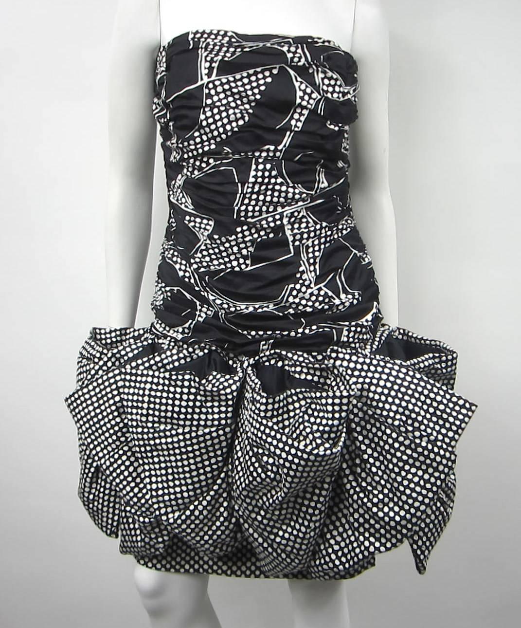 Black and  white Cotton Victor Costa 1980s Dress. Fun and Flirty 
Take a look at the huge bow surrounding the dress
Underneath in is a tight fitting pencil skirt 
Ruched Body
Bust 35
Waist 29
Hips 36 
Length 31
Any questions please call, email or