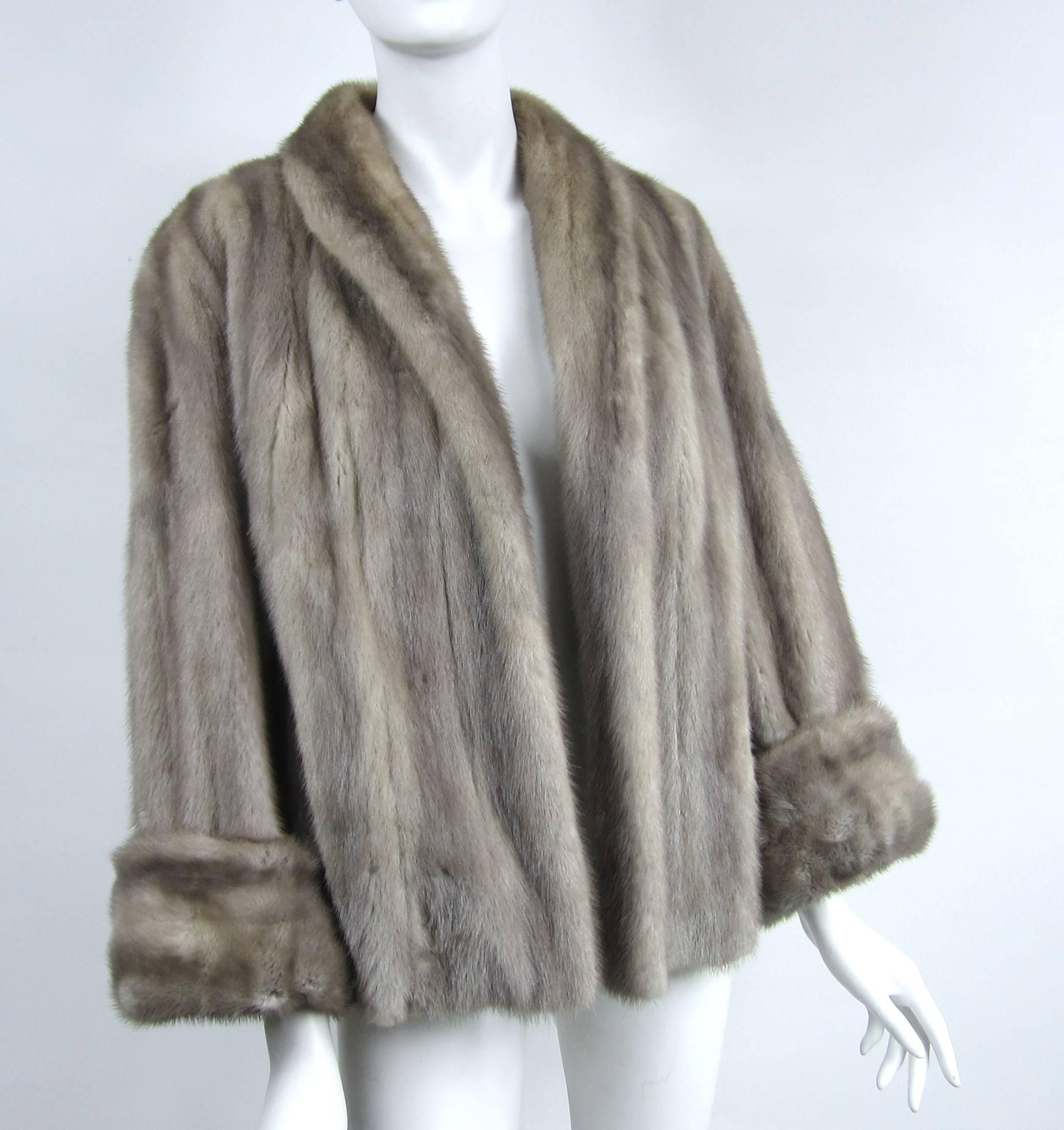 Stunning color on this Mink Jacket. Stunning large cuffs on this one, which can be worn down as well 
Measuring 
Up to 42 inch on the bust 
Open waist 
Sleeve 22 inches 
Sleeve cuff 4 inch 
down the back length is 25-1/4 
Any questions please call,