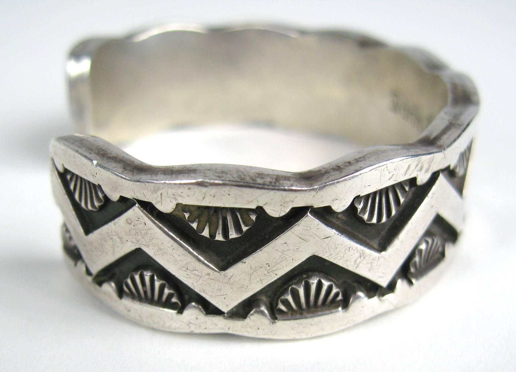 Stunning craftsmanship on this Darin Bill sterling Silver cuff bracelet. Intricate design which will be perfect for both men and woman. 
A famous Navajo artist who has a very recognizable style. He only creates "heavy" bracelets which is