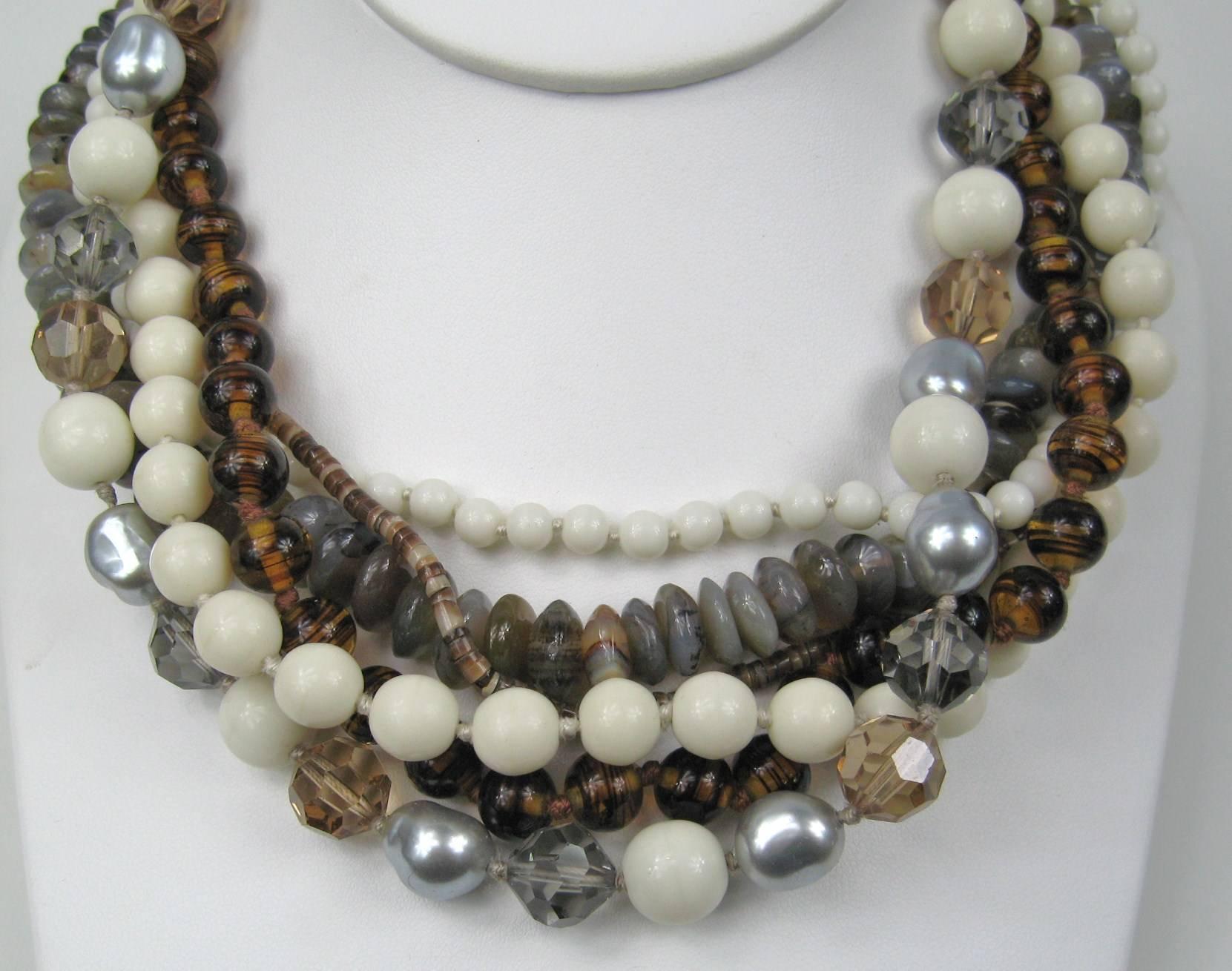 This is stunning in person, faceted crystal, glass and stone beading make up this 6 strand Ciner New old stock necklace. Measures 19 inches end to end. Visit our store front for hundreds of designer costume jewelry as well as sterling silver. Be