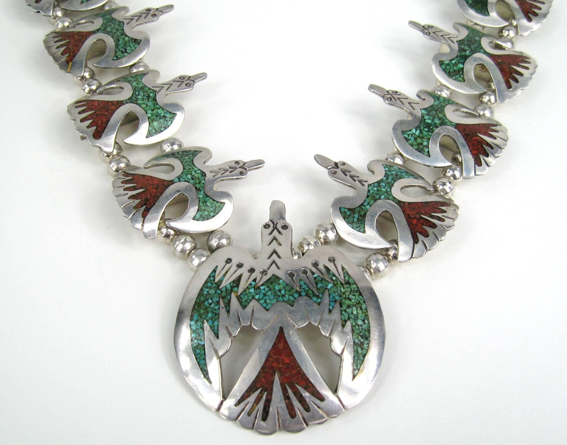 Stunning Silver silver Squash Blossom necklace Crushed Turquoise and Coral Measures Naja is 2.90 inches  x 2.24 Down to 2 inches  x 1.40 inches Double beaded Total length is 30 inches long. This is out of a massive collection of Hopi, Zuni, Navajo,