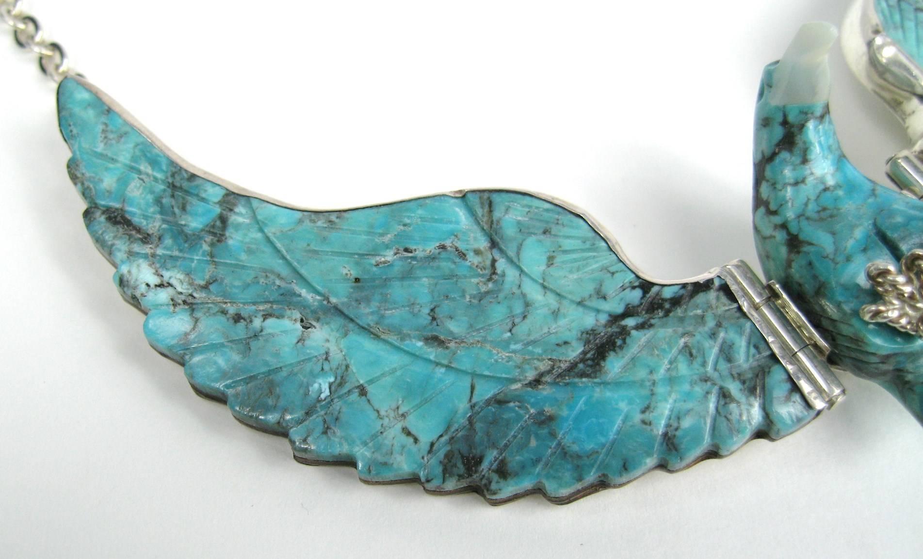 Massive at 4.75 inch wing span on this Turquoise Eagle Navajo Made of stunning carved Turquoise backed on sterling. Made by Sheila Tso Hinged wings Drops down 22 inches This is out of a massive collection of Hopi, Zuni, Navajo, Southwestern and