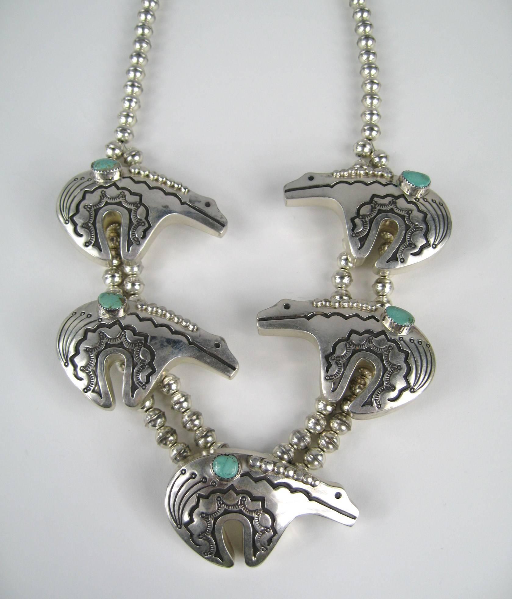 This is a fantastic piece of wearable art Native American ~ Bear Fetish necklace in sterling silver. Circa 1970s-80s. Large detailed bear with bezel set Turquoise stone throughout. Measures 26 in end to end. Each Bear measures 1.6 in x 2.56 in wide-