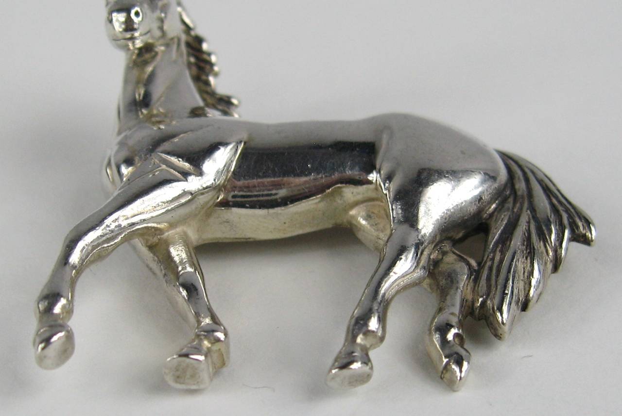Sterling Silver depicting a Galloping Horse. Measuring 1.69 in x 1.85 in. Exceptionally Detailed work done on this piece. This is out of a massive collection of Hopi, Zuni, Navajo, Southwestern, sterling silver, costume jewelry and fine jewelry from