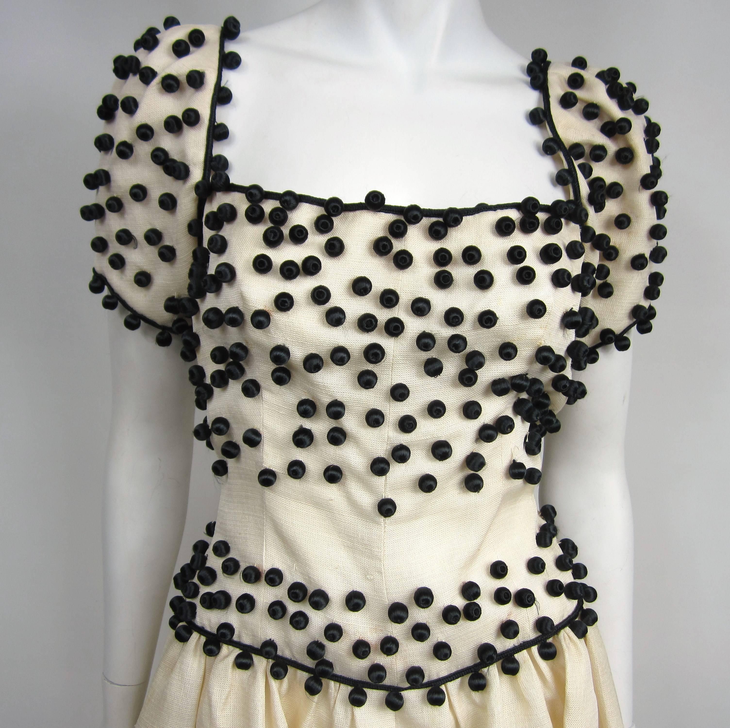 Givenchy Cream / Black Embellished Dress out of the same collection of our YSL Russian pieces. This is stunning in person. Bodice is lined, zippers up the back. Full inverted pleated skirt, low back and cap sleeves.  Just stunning. The dress