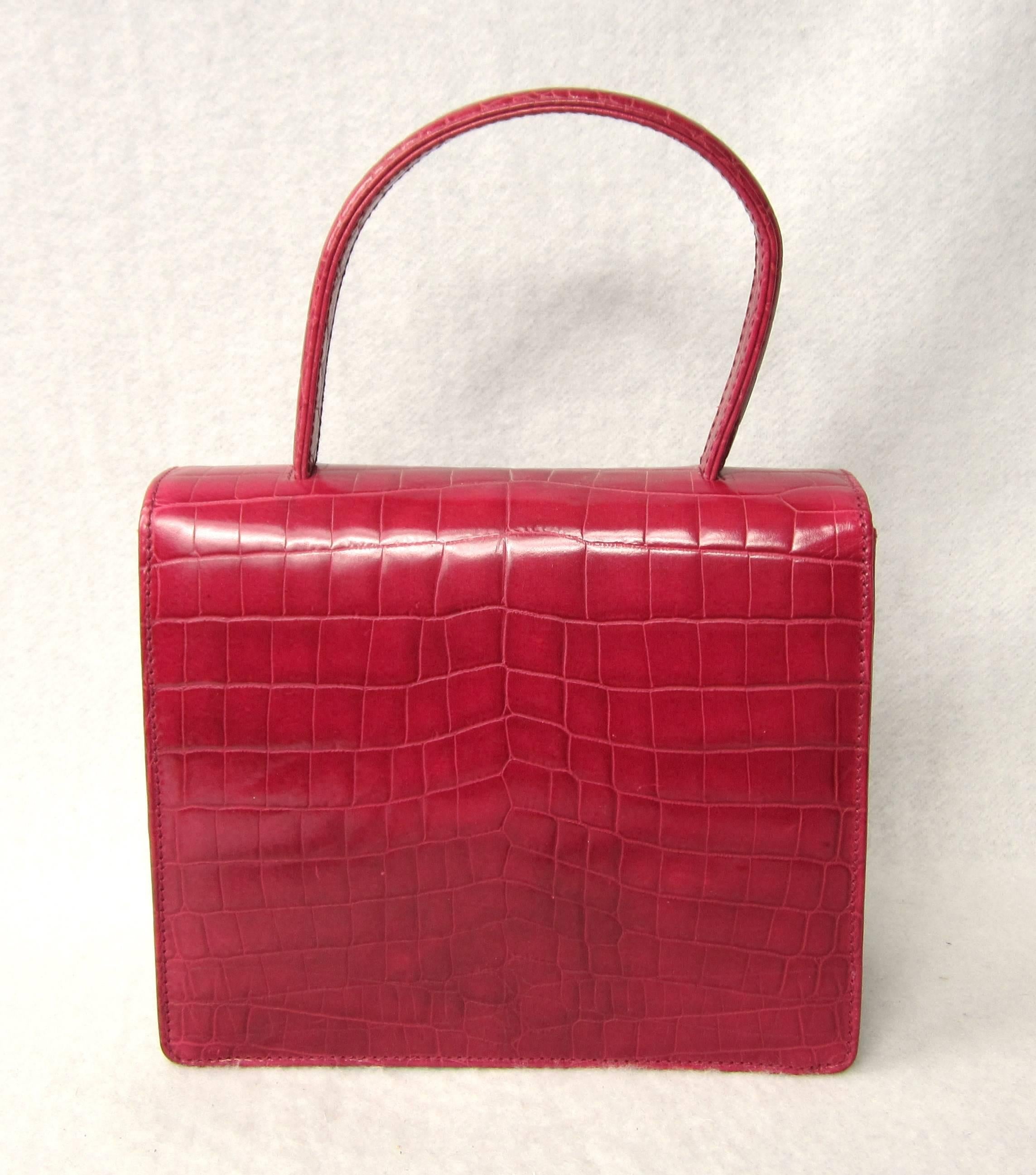 Stunning Dead stock Escada Made in Italy Leather Hand Bag with Silver tone hardware a Magnetic closure. Measuring 7.5 wide x 6.5 H x 2.75 deep 
One main compartment and a small compartment inside. This is out of a massive collection of Designer