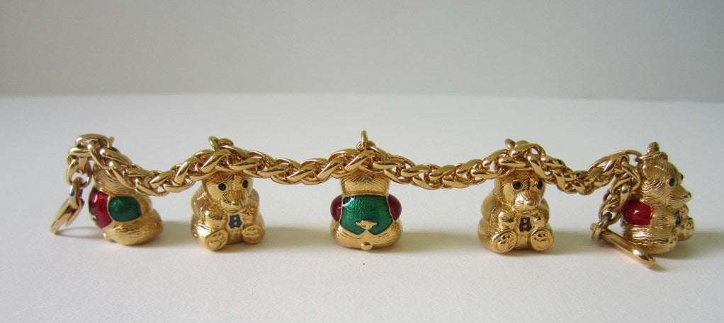  Signed Judith Leiber  Teddy Bear Charm Bracelet In excellent condition. measures 6.5 in end to end.  Teddy Bears are .75 in Tall. You have a signature on the lobster claw clasp. Bears are Red, Green and Black enamel....This is out of a massive