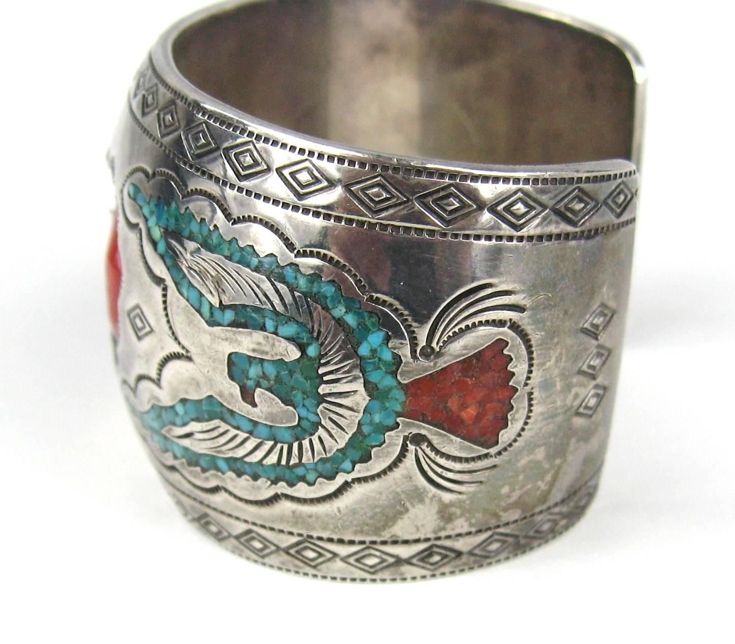 Stunning craftsmanship on this Navajo Sterling Bracelet. Turquoise Matrix inlay on both sides of the bracelet with 3 Large stones laid into a shadow box measuring 1.50 in.  wide. 1.27 in.  on the opening. This will fit a 6 to 6.5 wrist fine. A bit
