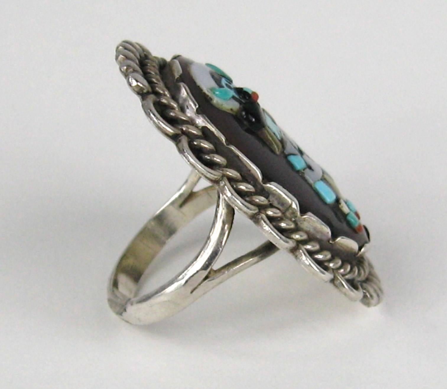 Stunning craftsmanship on this sterling Native American Ring Measuring 1.46 in.  x 1.07 in. Hallmarked A.R.P Augustine & Rosalie Pinto amazing silver smiths. Augustine and Rosalie Pinto were the last of the great Zuni Silversmiths who worked by hand