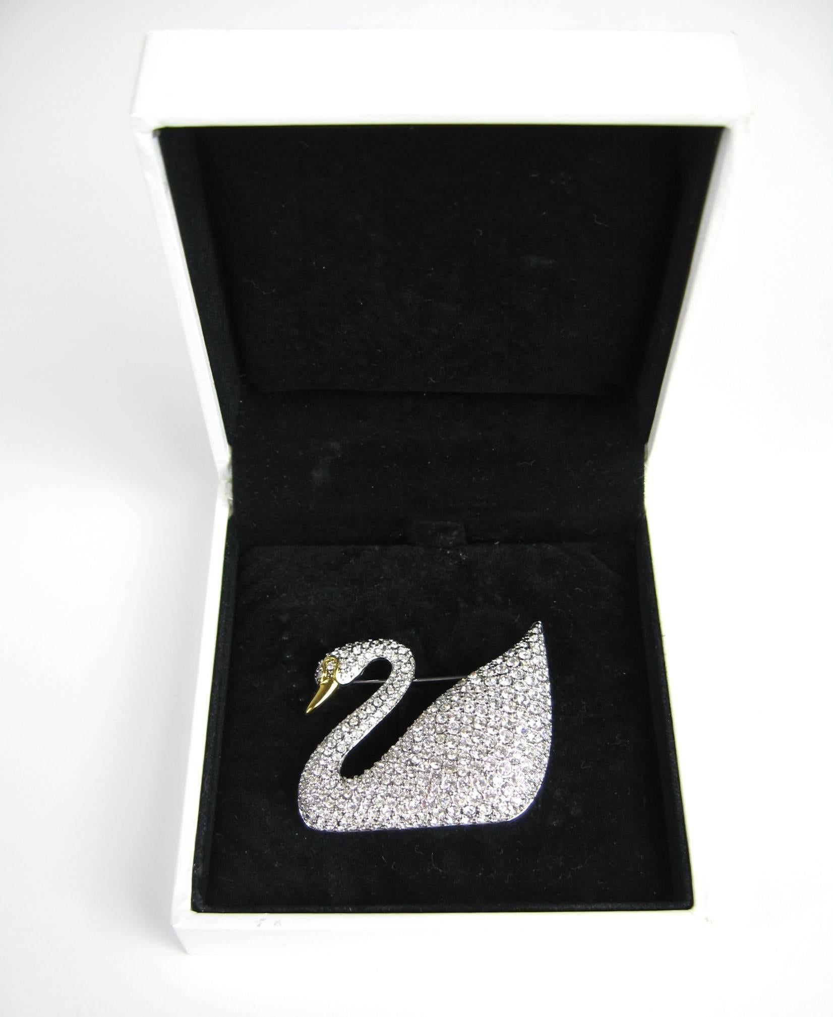 Stunning Swarovski Crystal Swan brooch new in original box. Pave set crystals make up the entire pin with exception of the beak. Measuring approximately 2.19 in  / 55.85mm x 1.42 in.  / 36.18mm. This is out of a massive collection of Hopi, Zuni,