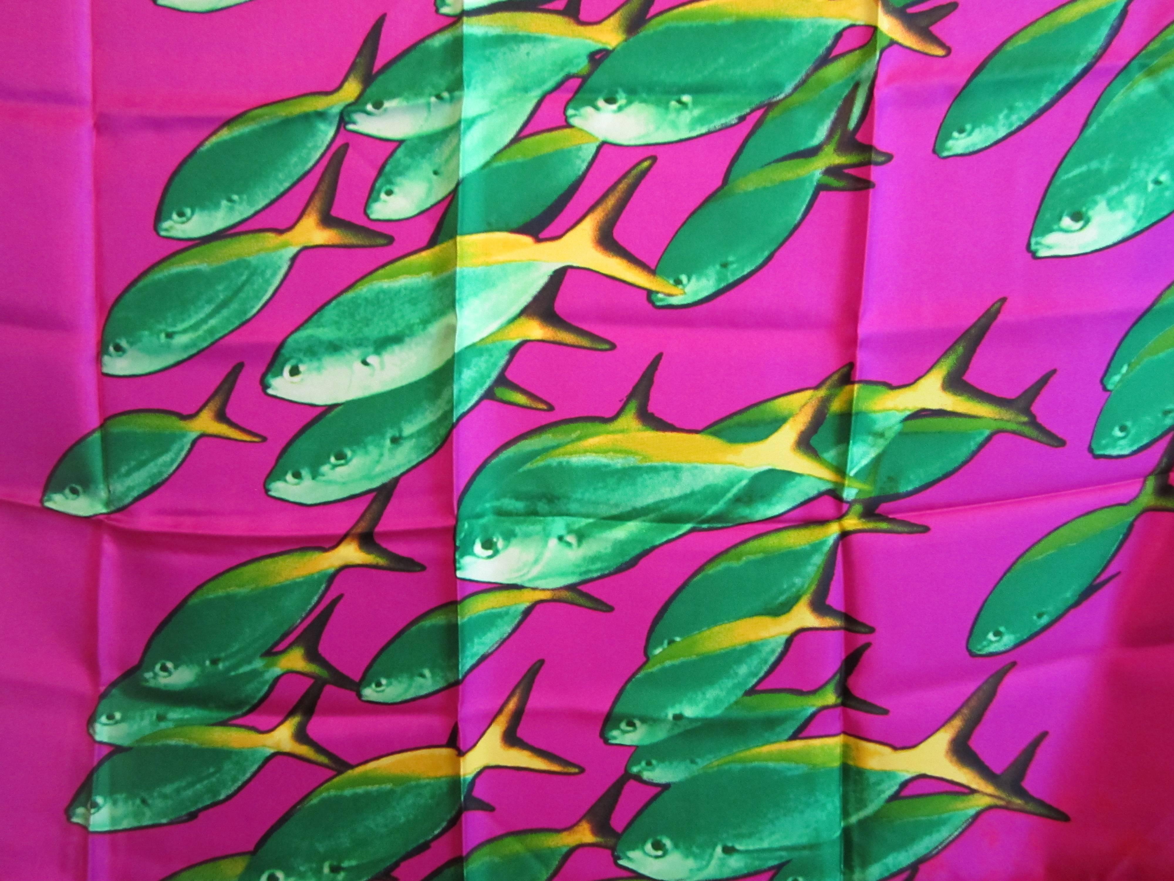 This is from a Vast Collection of Scarves that have never been worn. This one is Featuring an underwater scene of fish. Vibrant Purple and green. Made in Italy. Hand Rolled Silk. This is out of a massive collection of Contemporary Fashion as well as