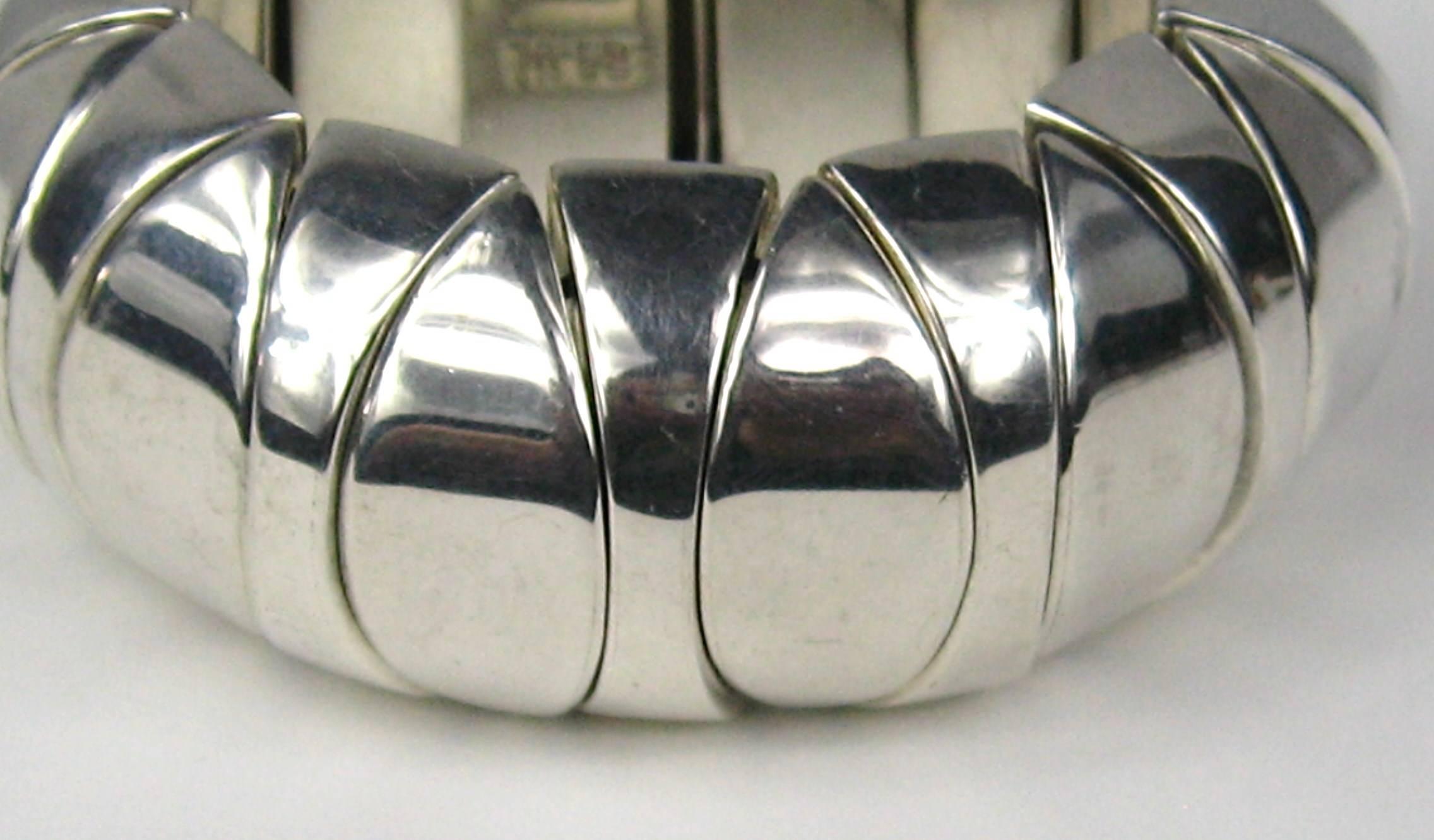 large scale Mexican sterling silver bracelet. Strung together with elastic making it an easy fit for a many size wrists. Measures 1.1 inches wide, Hallmarked inside bracelet. This is out of a massive collection of Contemporary Fashion as well as 