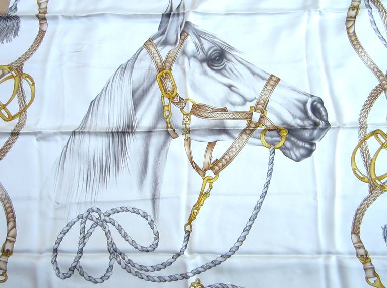 This is from a Vast Collection of Scarves that have never been worn. Featuring a Stunning side of a majestic horse. White background with a golden beige and grays. Made in Italy. Hand Rolled Silk. This is out of a massive collection of Hopi, Zuni,