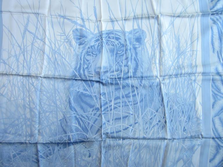 This is from a Vast Collection of Scarves that have never been worn. Featuring a Tiger in the center, baby blue and white in color. Made in Italy. Hand Rolled Silk. Approx. 34 x 34. We have tons of Gucci, Escada and some Hermes left. This is out of