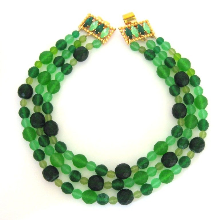 Yet again, we have another stunning piece from Dominique Aurientis. Faceted Green Glass Beads, in different shades of Green. 3 strands that graduate in size, drapes like a bib. The Beads graduate in size as well ranging from 15.36mm, 13.98mm, 8.93