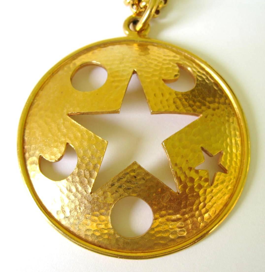 Huge Celine Disc Star cutout necklace designed by Celine. 32 inch long chain. 3 inch diameter disc. This is out of our massive collection of Hopi, Zuni, Navajo, Southwestern, sterling silver, costume jewelry and fine jewelry from one collector. Be