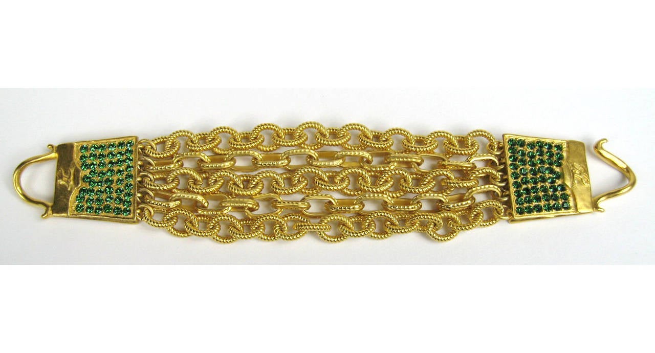 Stunning Lagerfeld Handbag bracelet. New Old Stock (purchased back in the 90s and never worn). 5 chain links make up this Fabulous bracelet
Measuring 8 inches  end to end. Will fit a 6-7.5  wrist depending on how you like your fit. Earrings,