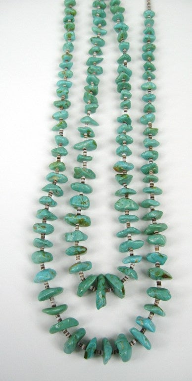 Southwestern Turquoise and Heishi Shell Necklace. Measures 26 in end to end. Stones measures approx. 15mm /.50 In  x 6.6mm / .26 In.. Stones graduate in size. This is out of our massive collection of Hopi, Zuni, Navajo, Southwestern, sterling