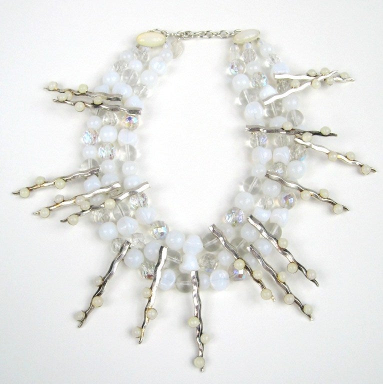Stunning piece from Parisian Artisan Phillipe Ferrandis. You have here a combination of faceted clear and Matte white glass beads on a multi strand Bib. Measuring approx. 16- 18in long. Another piece that was purchased and stored away. This is out