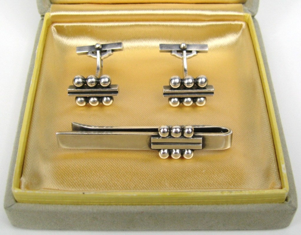 Stunning set of Jensen Cufflinks # 61B with matching Tie Bar #61 still in their original box. Designed By Harald Nielsen. Great gift idea for that someone special in your life. This is out of our massive collection of Hopi, Zuni, Navajo,