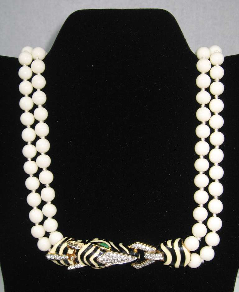 Stunning Ciner Double Strand Cream pearl necklace. Clasp is  a enameled Zebra with Swarovski Crystals. Wonderful Green Cabochons eyes. Measuring 40 end to end. 9.63 mm on the pearls. This is out of a massive collection of Hopi, Zuni, Navajo,
