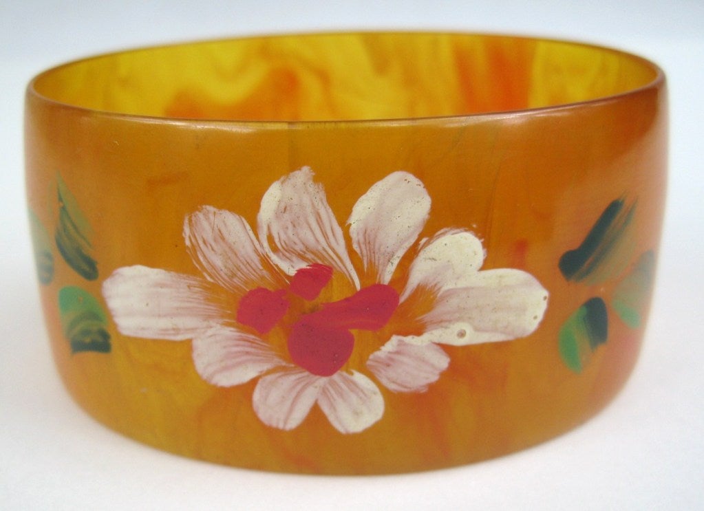 This is a stunning bangle that is Early Vintage hand painted Bakelite.This piece was carefully crafted by someone who knew what they the doing. The marbling is fabulous! measures inside 2.76 x 2.25 would fit a smaller wrist. Many more pieces of