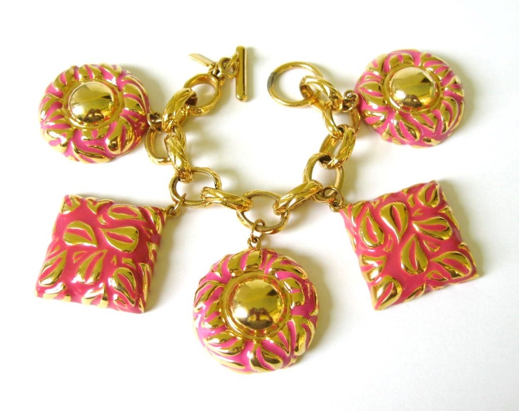 Chunky Pink Charm Bracelet with Square and circular charms. Toggle closure.  A bit of wear on the toggle closure. Circle is 1.60  in diameter. Square is 1.45 W x 1.45. 7.5 long. Matching Necklace and earrings are on our storefront. This is out of a