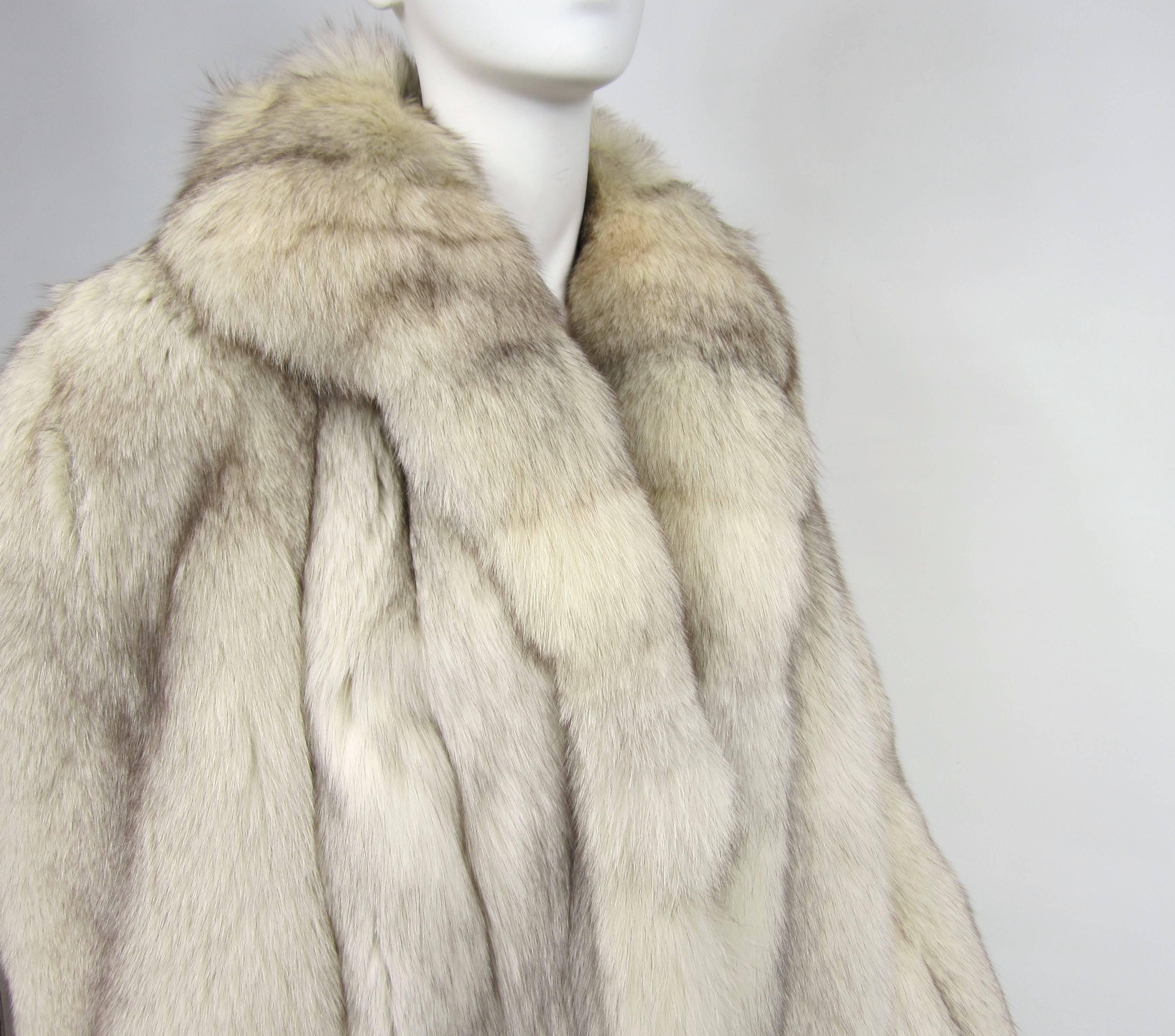 Large supple pelts on this full length Fox Coat with Slit side pockets Measurements Bust up to 40 / Waist up to 42 /Hips up to 44 / Sleeve 24.5 / Long 51--This will fit a 10-12 nicely. Be sure to check out our store front for many more fur including