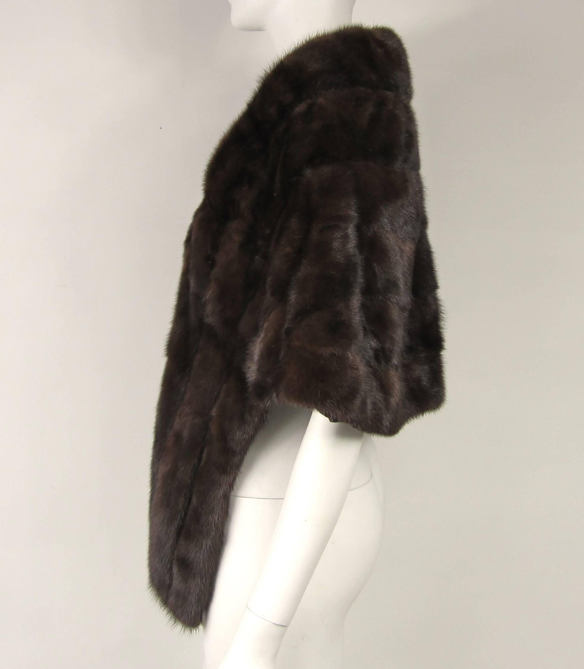 Deep rich Ranch Mink, soft and supple mink Has a Portrait Collar. No monogram/ Brown silk lining. Will fit a Med to Large. Measuring 30 in across arm to arm/ 42 in down the front / 32 in down the back. Slit pockets. Be sure to check out our store